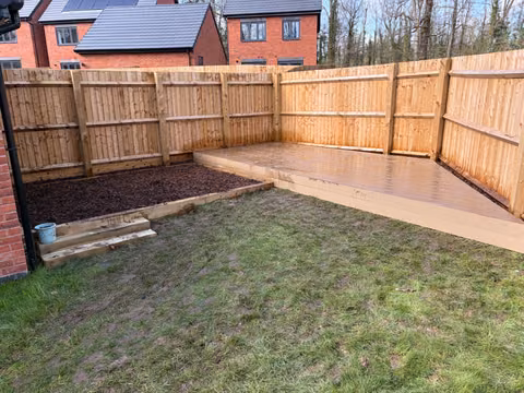 NeoTimber composite deck and bark-covered children’s play area in a Barrow Gurney garden