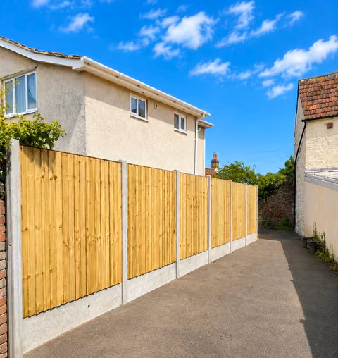 Closeboard fence panels installed with concrete posts and concrete gravel boards