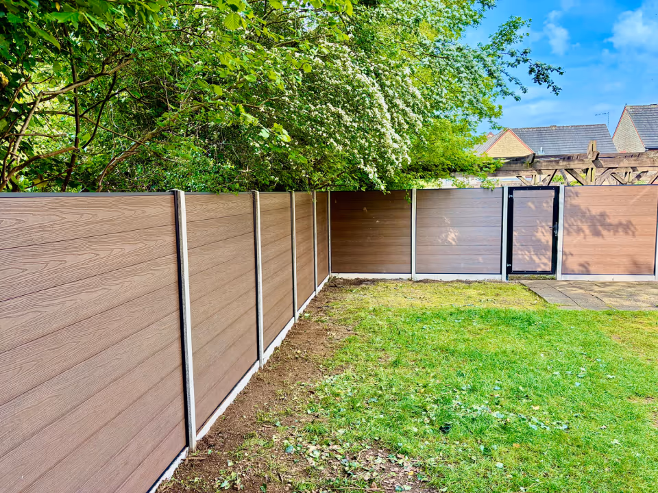 Composite garden gate designed to match woodgrain composite fencing