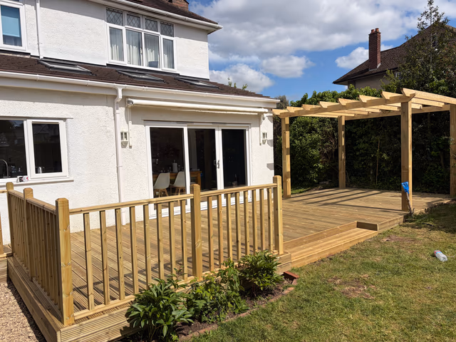 Raised timber deck with balustrade, steps and pergola
