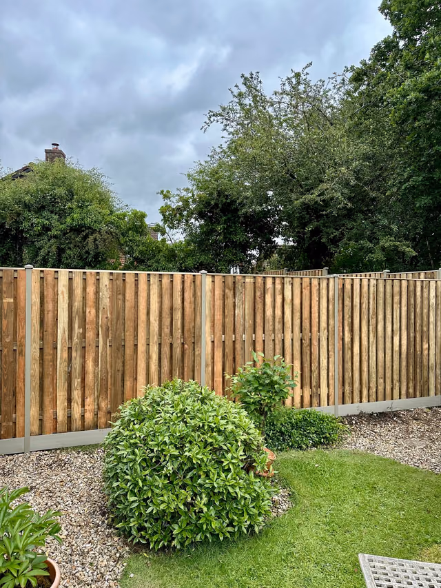 Completed hit-and-miss timber fence with olive grey DuraPost supports